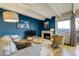 Living room features a modern fireplace, hardwood floors, textured wall, large window with city views at 200 N Pearl St # 404, Denver, CO 80203