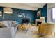 Living room features a modern fireplace, hardwood floors, textured wall, and decor at 200 N Pearl St # 404, Denver, CO 80203