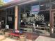 Exterior of Rise & Shine Biscuit Kitchen with large windows, outdoor seating, and signage advertising lunch at 200 N Pearl St # 404, Denver, CO 80203