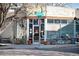 Charming exterior view of Rosebud Cafe with outdoor seating, large windows, and a corner location at 200 N Pearl St # 404, Denver, CO 80203