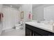 Bathroom featuring a vanity sink with a shower and bath combo at 7315 Blue Water Dr, Castle Rock, CO 80108