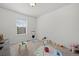 Well-lit playroom with a neutral carpet, toys, and bright natural light at 7315 Blue Water Dr, Castle Rock, CO 80108