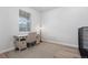 Bedroom featuring a desk, chair, rug, and natural light from a window with blinds at 7315 Blue Water Dr, Castle Rock, CO 80108