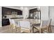 Eat-in kitchen featuring granite island with seating, pendant lights, and stainless steel appliances at 7315 Blue Water Dr, Castle Rock, CO 80108