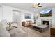 Open-concept living room with a fireplace, a comfortable sofa, and views into the entryway at 7315 Blue Water Dr, Castle Rock, CO 80108