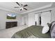 Spacious main bedroom with carpet and an ensuite bathroom with barn door entrance at 7315 Blue Water Dr, Castle Rock, CO 80108