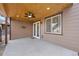 Covered patio with wood ceiling features a ceiling fan, recessed lighting and outdoor access at 7315 Blue Water Dr, Castle Rock, CO 80108