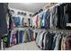 Spacious walk-in closet with ample storage for clothing and accessories at 7315 Blue Water Dr, Castle Rock, CO 80108