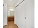 Bathroom with wood vanity, mirror, and sliding closet doors at 14465 E 1St Dr # C7, Aurora, CO 80011