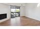 Bright living room featuring a fireplace and sliding glass door to a balcony at 14465 E 1St Dr # C7, Aurora, CO 80011