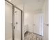 Modern bathroom features a tile shower with glass door, and a vanity with drawers at 577 Nightsky St, Erie, CO 80516
