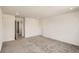 Large bedroom with neutral walls, carpet, and baseboard trim, and a closet at 577 Nightsky St, Erie, CO 80516
