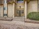 Apartment building entrance with steps and landscaping at 7645 E Quincy Ave # 105, Denver, CO 80237