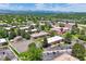 Scenic aerial view of complex offering community amenities, lush lawns and mountain views at 3613 S Sheridan Blvd # 10, Denver, CO 80235