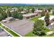 A lovely aerial view shows the basketball court next to a playground surrounded by attractive apartments at 3613 S Sheridan Blvd # 10, Denver, CO 80235