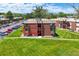 Brick apartment building with scenic mountain views and well-manicured lawn at 3613 S Sheridan Blvd # 10, Denver, CO 80235