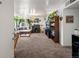 Cozy living room featuring natural light, plants, comfortable seating, and lots of personality at 3613 S Sheridan Blvd # 10, Denver, CO 80235