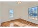 Well-lit bedroom with hardwood floors and large windows at 438 Inca St, Denver, CO 80204