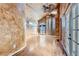 Living room features hardwood floors, glass block windows, and a sliding barn door at 438 Inca St, Denver, CO 80204