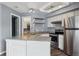 Kitchen with stainless steel refrigerator, granite countertop, and stainless steel appliances at 5250 S Huron Way # 1-204, Littleton, CO 80120