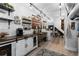 Rustic basement kitchen with farmhouse sink and ample storage at 885 S Sherman St, Denver, CO 80209