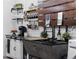 Charming basement kitchen with farmhouse sink and modern appliances at 885 S Sherman St, Denver, CO 80209