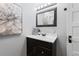 Basement bathroom with updated vanity and stylish mirror at 885 S Sherman St, Denver, CO 80209