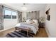 Bright bedroom with a king-size bed and barn door accents at 885 S Sherman St, Denver, CO 80209