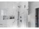 Elegant shower with marble tile and glass enclosure at 885 S Sherman St, Denver, CO 80209