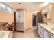 Beautiful bathroom featuring custom cabinets, double sinks, and tiled floor at 1495 S Chase Ct, Lakewood, CO 80232