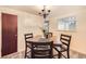 Cozy dining room with seating for four and modern overhead lighting at 1495 S Chase Ct, Lakewood, CO 80232