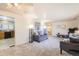 Spacious living room with neutral color palette, soft carpet, and ample seating at 1495 S Chase Ct, Lakewood, CO 80232