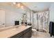 Bathroom with single vanity, shower/tub combo, and modern decor at 14204 W 88Th Dr # C, Arvada, CO 80005