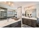 Double vanity bathroom with modern finishes and a walk-in shower at 14204 W 88Th Dr # C, Arvada, CO 80005