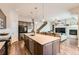 Modern kitchen with a large island and open layout to living area at 14204 W 88Th Dr # C, Arvada, CO 80005