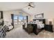 Spacious main bedroom with mountain views, plush bedding, and ample natural light at 14204 W 88Th Dr # C, Arvada, CO 80005