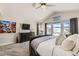 Main bedroom with a large bed, mountain views and plenty of natural light at 14204 W 88Th Dr # C, Arvada, CO 80005