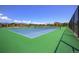 Two well-maintained tennis courts with green and blue surface at 14204 W 88Th Dr # C, Arvada, CO 80005