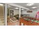 Finished basement featuring a TV, foosball, and ping pong table at 6392 S Lafayette St, Centennial, CO 80121