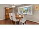 Formal dining room with hardwood floors, large window, and chandelier lighting at 6392 S Lafayette St, Centennial, CO 80121