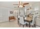 An open dining area features a large mirror, a wooden bench, and direct access to kitchen at 6392 S Lafayette St, Centennial, CO 80121