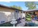 A beautiful walkway and garden at the front of a brick home. Also a fountain at 6392 S Lafayette St, Centennial, CO 80121