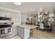 Updated kitchen featuring an island with quartz countertop, white subway tile backsplash, and stainless steel appliances at 6392 S Lafayette St, Centennial, CO 80121