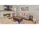 Bright living room with a brick fireplace, hardwood floors, and stylish furnishings at 6392 S Lafayette St, Centennial, CO 80121