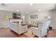 Spacious living room with fireplace, hardwood floors, and neutral decor at 6392 S Lafayette St, Centennial, CO 80121
