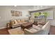 Cozy living room with window, hardwood floors, and comfortable seating arrangements at 6392 S Lafayette St, Centennial, CO 80121