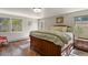 Cozy main bedroom with hardwood floors, large windows, and soft, natural lighting at 6392 S Lafayette St, Centennial, CO 80121