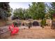 Charming yard with a grill and lovely black and white umbrella at 2480 W Caithness Pl # 5, Denver, CO 80211