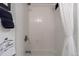 Clean, tiled shower with white curtain and modern fixtures at 2480 W Caithness Pl # 5, Denver, CO 80211
