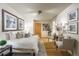 Spacious bedroom with seating area, wood floors, and tasteful decorations at 2480 W Caithness Pl # 5, Denver, CO 80211